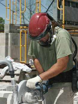 Photo of man using saw