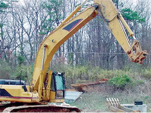 Quick-disconnect excavator bucket that detached from the excavator stick.