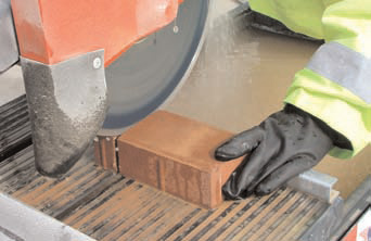 photo of a power saw with dust compression being used.