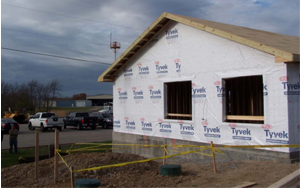 This is a picture of a construction site where a men fell from the roof.\