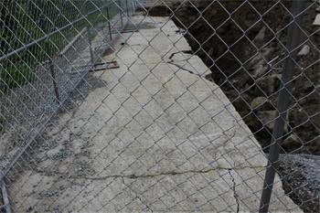 This is a photo of the cracked parking lot surrounding the trench.