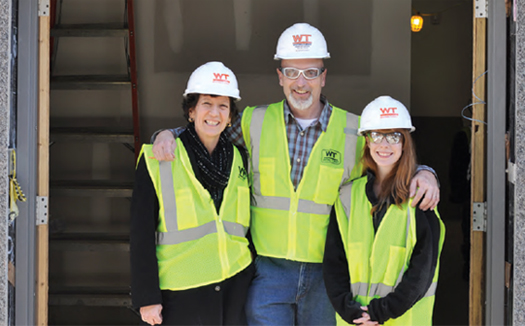 photo of people in hard hat and reflective vests