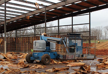 Figure 2. Genie model S-45 boom lift used to transfer roofers and materials to roof.