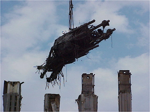 photo of a metal dangerous object suspended and moving through the air on a line.